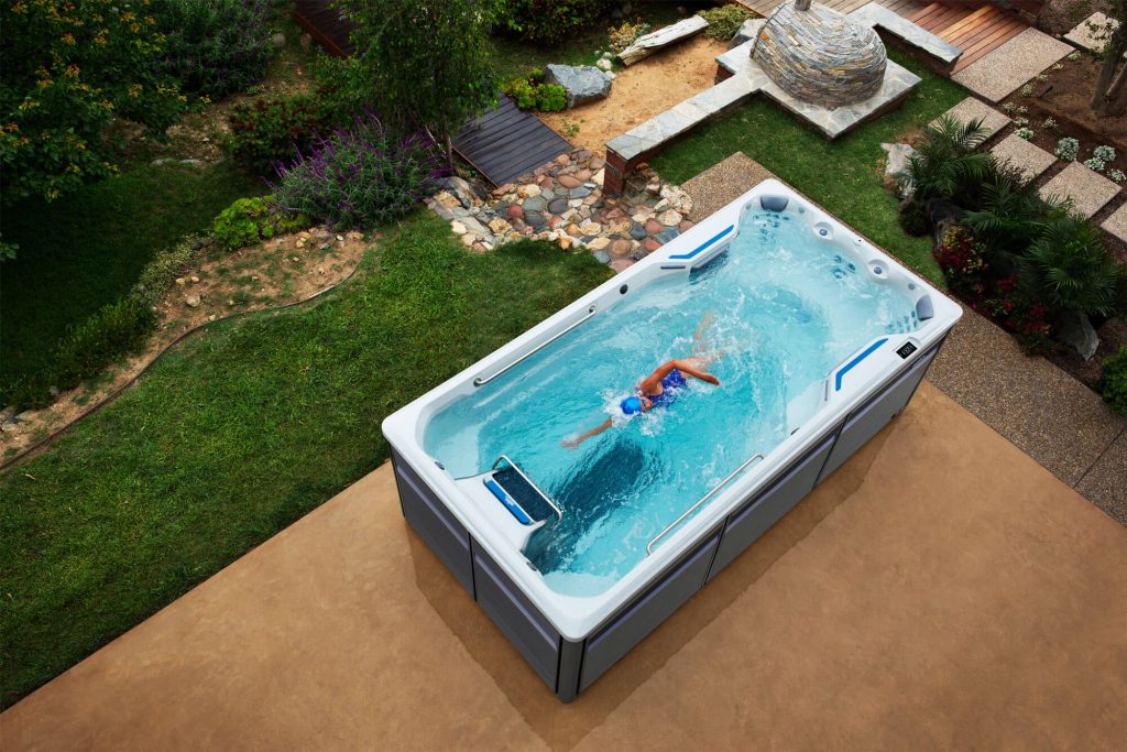 Swimmer training against the current in an Endless Pools swim spa