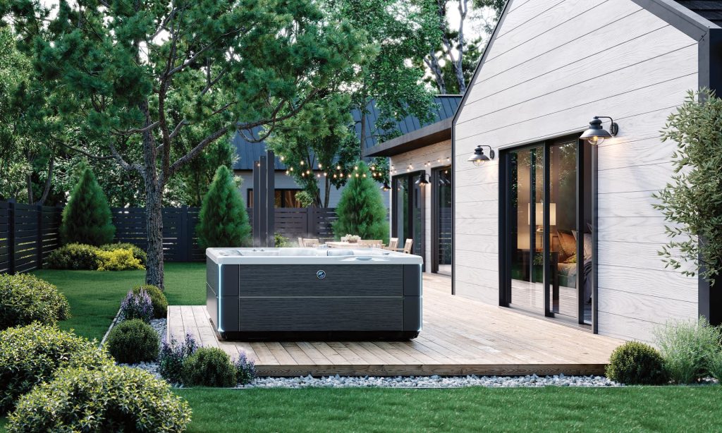 Hot tub installed on a backyard deck close to the house