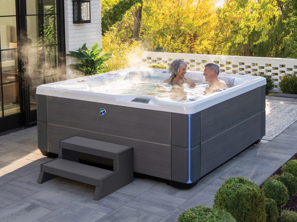 Hot Spring hot tub on a paver patio with spa steps